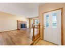 71 Quigley Drive, Cochrane, AB  - Indoor Photo Showing Other Room With Fireplace 