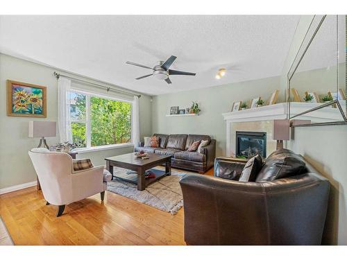 40 Wentworth Close Sw, Calgary, AB - Indoor Photo Showing Living Room With Fireplace