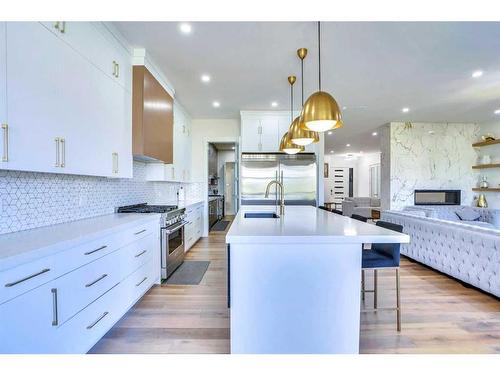 108 Hampstead Mews Nw, Calgary, AB - Indoor Photo Showing Kitchen With Fireplace With Upgraded Kitchen