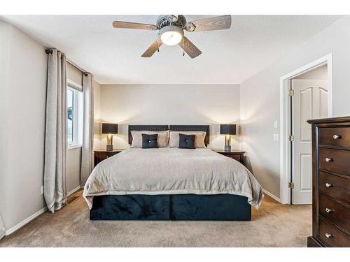 228 Stonegate Place Nw, Airdrie, AB - Indoor Photo Showing Bedroom