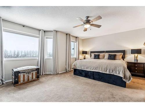 228 Stonegate Place Nw, Airdrie, AB - Indoor Photo Showing Bedroom