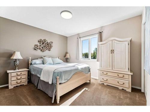 228 Stonegate Place Nw, Airdrie, AB - Indoor Photo Showing Bedroom