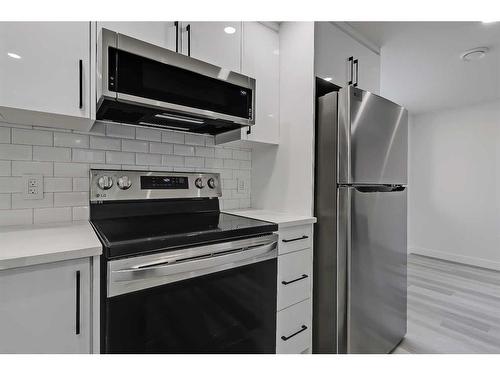 1272 Hunterburn Crescent Nw, Calgary, AB - Indoor Photo Showing Kitchen With Stainless Steel Kitchen