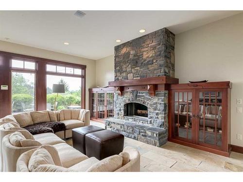 32 Wolfwillow Ridge, Rural Rocky View County, AB - Indoor Photo Showing Living Room With Fireplace