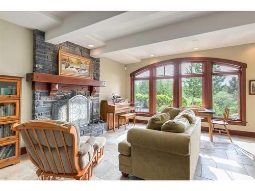 32 Wolfwillow Ridge, Rural Rocky View County, AB - Indoor Photo Showing Living Room With Fireplace