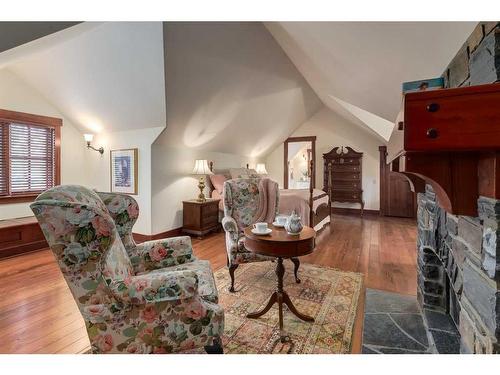 32 Wolfwillow Ridge, Rural Rocky View County, AB - Indoor Photo Showing Living Room With Fireplace