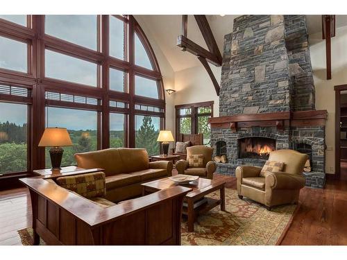 32 Wolfwillow Ridge, Rural Rocky View County, AB - Indoor Photo Showing Living Room With Fireplace