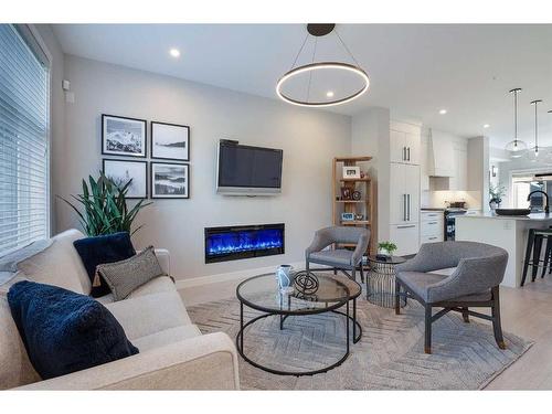 3008 85 Street Sw, Calgary, AB - Indoor Photo Showing Living Room With Fireplace