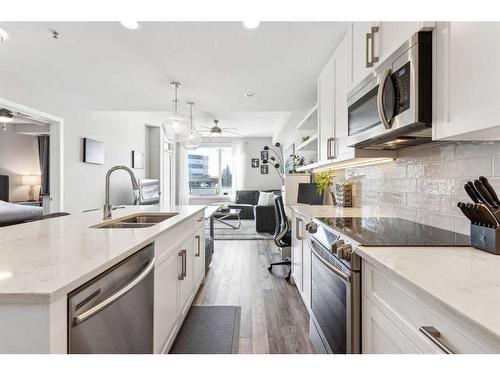 113-8530 8A Avenue Sw, Calgary, AB - Indoor Photo Showing Kitchen With Stainless Steel Kitchen With Double Sink With Upgraded Kitchen