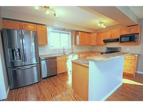 2 Bridlecrest Gardens Sw, Calgary, AB - Indoor Photo Showing Kitchen With Stainless Steel Kitchen With Double Sink