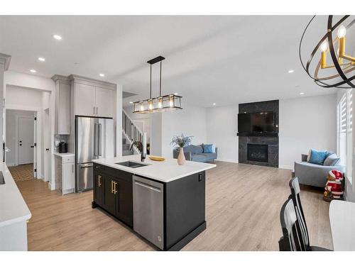 275 Lucas Way, Calgary, AB - Indoor Photo Showing Kitchen With Fireplace With Double Sink With Upgraded Kitchen