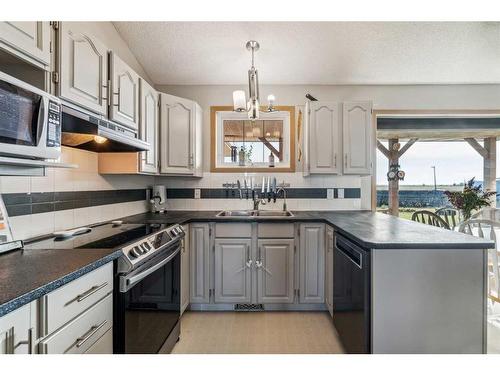 272187 Township Road 240, Rural Rocky View County, AB - Indoor Photo Showing Kitchen With Double Sink