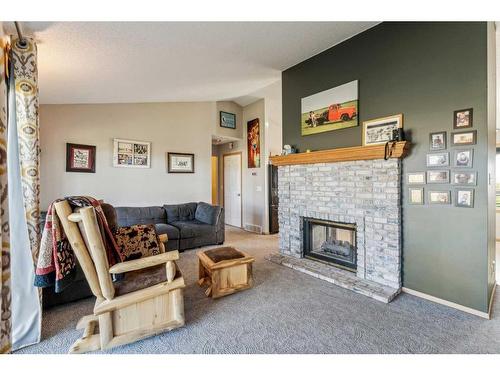 272187 Township Road 240, Rural Rocky View County, AB - Indoor Photo Showing Living Room With Fireplace