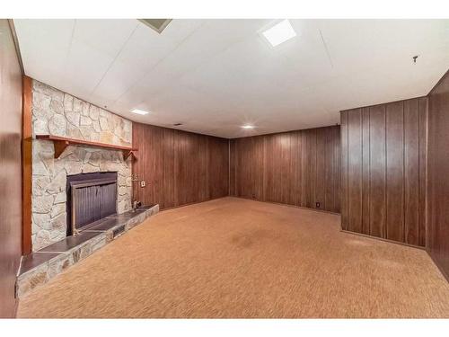 1107 Hunterston Hill Nw, Calgary, AB - Indoor With Fireplace