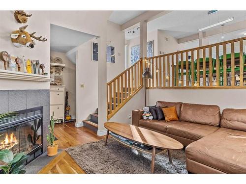 224 Jasper Way, Banff, AB - Indoor Photo Showing Living Room With Fireplace