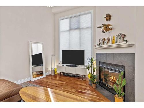 224 Jasper Way, Banff, AB - Indoor Photo Showing Living Room With Fireplace