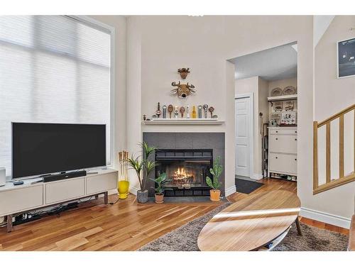 224 Jasper Way, Banff, AB - Indoor Photo Showing Living Room With Fireplace