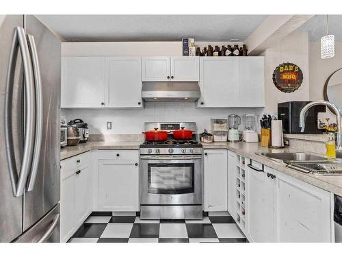 224 Jasper Way, Banff, AB - Indoor Photo Showing Kitchen With Double Sink