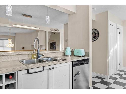 224 Jasper Way, Banff, AB - Indoor Photo Showing Kitchen With Double Sink