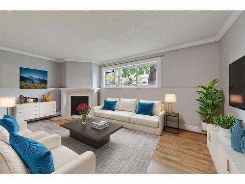 101-1817 11 Avenue Sw, Calgary, AB - Indoor Photo Showing Living Room With Fireplace