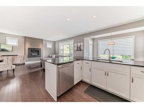 270 Chaparral Valley Terrace Se, Calgary, AB - Indoor Photo Showing Kitchen With Fireplace