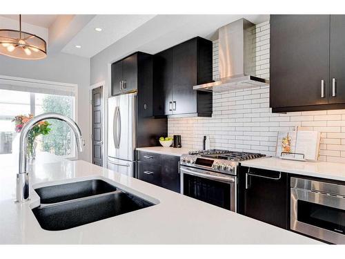 8028 Masters Boulevard Se, Calgary, AB - Indoor Photo Showing Kitchen With Double Sink With Upgraded Kitchen