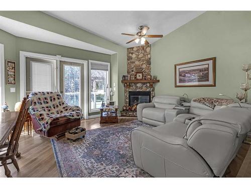 41 Rowland Lane, Okotoks, AB - Indoor Photo Showing Living Room With Fireplace