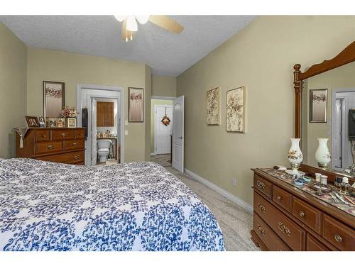 41 Rowland Lane, Okotoks, AB - Indoor Photo Showing Bedroom