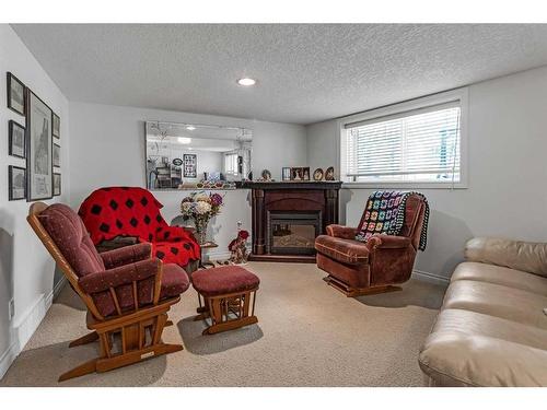 41 Rowland Lane, Okotoks, AB - Indoor Photo Showing Living Room With Fireplace