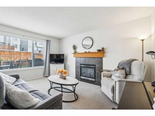 157 Evansmeade Circle Nw, Calgary, AB - Indoor Photo Showing Living Room With Fireplace