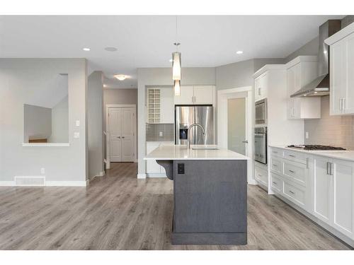 628 Midtown Place Sw, Airdrie, AB - Indoor Photo Showing Kitchen With Upgraded Kitchen