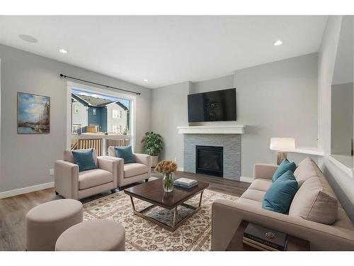 628 Midtown Place Sw, Airdrie, AB - Indoor Photo Showing Living Room With Fireplace