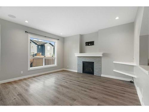 628 Midtown Place Sw, Airdrie, AB - Indoor Photo Showing Living Room With Fireplace