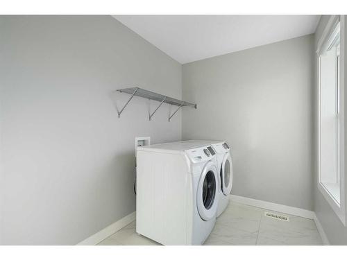 628 Midtown Place Sw, Airdrie, AB - Indoor Photo Showing Laundry Room