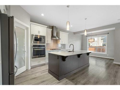 628 Midtown Place Sw, Airdrie, AB - Indoor Photo Showing Kitchen With Upgraded Kitchen