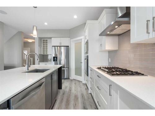 628 Midtown Place Sw, Airdrie, AB - Indoor Photo Showing Kitchen With Upgraded Kitchen