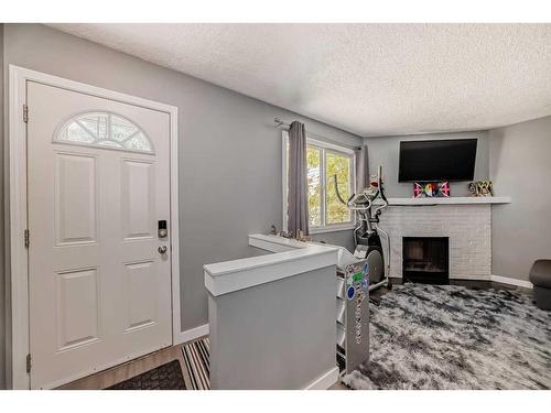 171 Templehill Drive Ne, Calgary, AB - Indoor With Fireplace