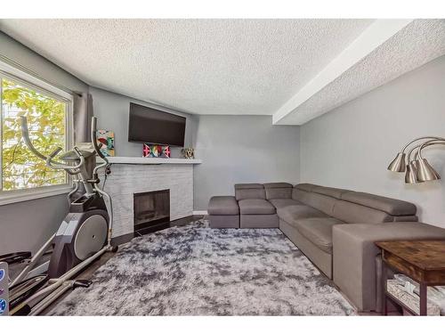 171 Templehill Drive Ne, Calgary, AB - Indoor With Fireplace