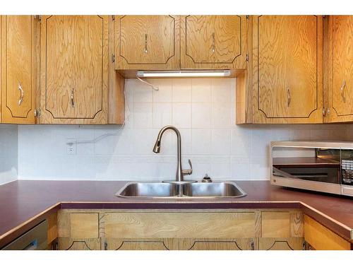 103 Ranch Glen Place Nw, Calgary, AB - Indoor Photo Showing Kitchen With Double Sink