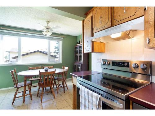 103 Ranch Glen Place Nw, Calgary, AB - Indoor Photo Showing Kitchen