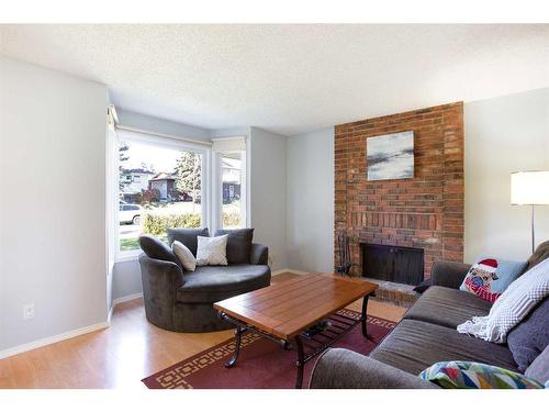 103 Ranch Glen Place Nw, Calgary, AB - Indoor Photo Showing Living Room With Fireplace