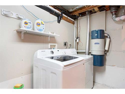 103 Ranch Glen Place Nw, Calgary, AB - Indoor Photo Showing Laundry Room