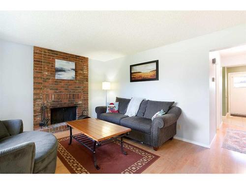 103 Ranch Glen Place Nw, Calgary, AB - Indoor Photo Showing Living Room With Fireplace