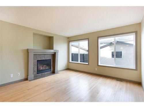 6 Cranberry Place Se, Calgary, AB - Indoor Photo Showing Living Room With Fireplace