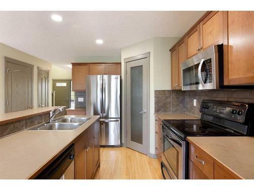 6 Cranberry Place Se, Calgary, AB - Indoor Photo Showing Kitchen With Stainless Steel Kitchen With Double Sink