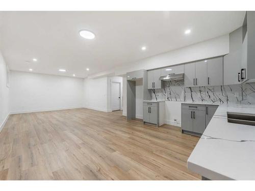 178 Kinniburgh Crescent, Chestermere, AB - Indoor Photo Showing Kitchen With Double Sink With Upgraded Kitchen