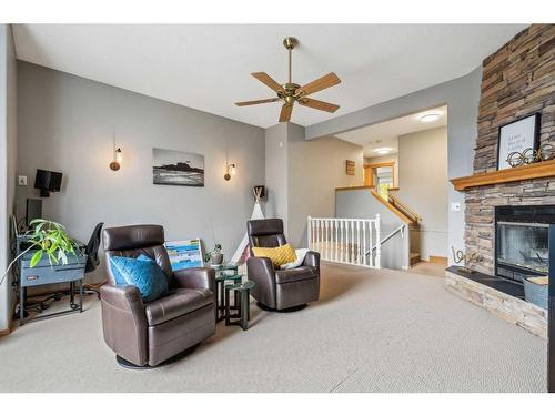 103 Cougarstone Gardens Sw, Calgary, AB - Indoor Photo Showing Other Room With Fireplace