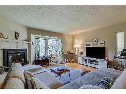 4212 1A Street Sw, Calgary, AB - Indoor Photo Showing Living Room With Fireplace