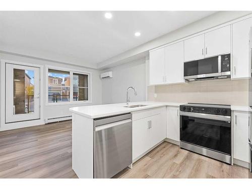 115-125 Wolf Hollow Crescent Se, Calgary, AB - Indoor Photo Showing Kitchen