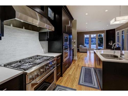 16 Spring Valley Way Sw, Calgary, AB - Indoor Photo Showing Kitchen With Double Sink With Upgraded Kitchen